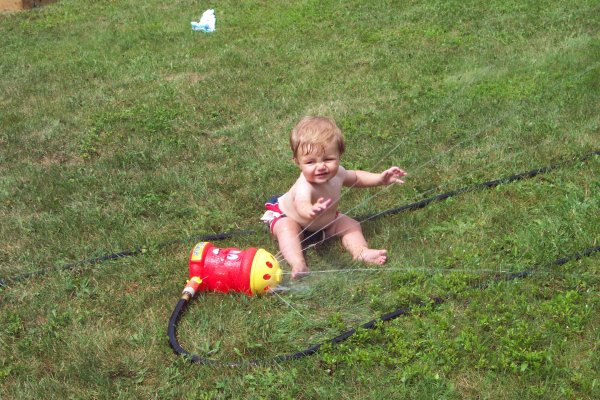 20050818 Andrew and Matthew playing with sprinkler 01