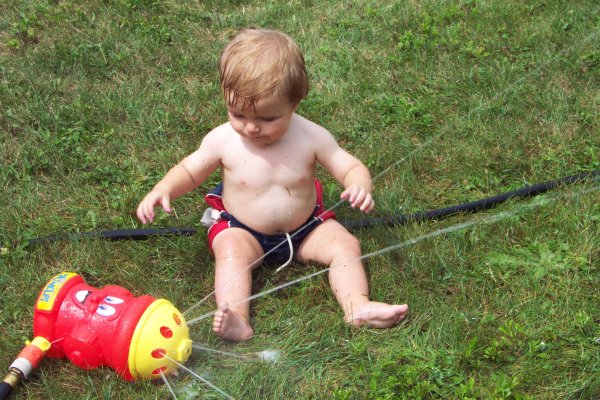 20050818 Andrew and Matthew playing with sprinkler 07