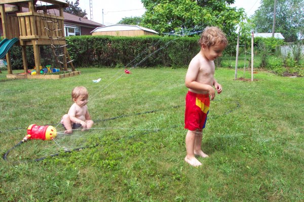 20050818 Andrew and Matthew playing with sprinkler 09