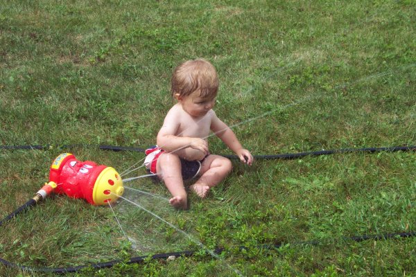 20050818 Andrew and Matthew playing with sprinkler 11